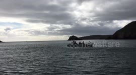 Family in a long-distance crossing rowing boat near Brixham