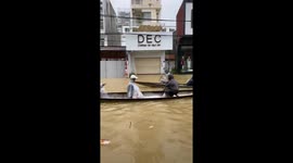 Mass flooding turns streets into streams across central Vietnam