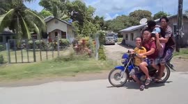 Motorcycle with five men crammed onboard in the Philippines