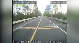 Drunk motorist luckily survives after his car is crushed by coach in southern China