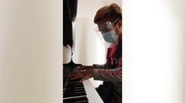Food delivery rider play grand piano beautifully while waiting for orders in shopping mall in Philippines