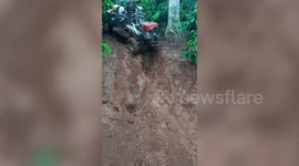 Coffee Farmer Struggles On Muddy Mountain Road In Vietnam