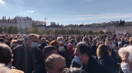 Crowd erupts with French national anthem as man attempts to disrupt rally honouring beheaded teacher