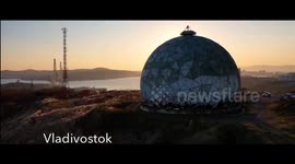 Vladivostok ecological shells in sea around boats. Russia. Military ship. People ships