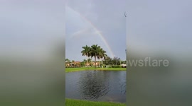 Faint double rainbow appears as rain stops during Florida early voting