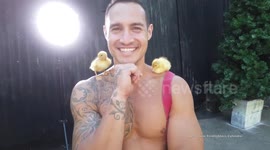 Saucy 2021 calendar depicts hunky Australian firefighters posing with some of the most adorable animals Australia has to offer