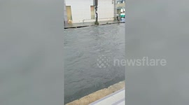 Floods Knock Over Row Of Motorcycles In Thailand