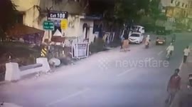 Watch: Moment out-of-control car smashes into barricade miraculously missing pedestrian