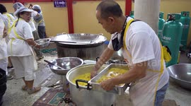 Thousands of vegetarian meals being prepared for Thai people at a Chinese temple during the vegetarian food festival