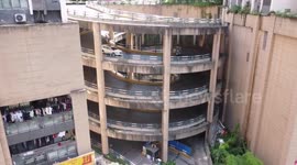 Residents in China's Chongqing have to drive up spiral ramp to reach their flats