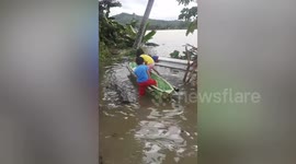 Children Play In Boat After Tropical storm Saudel Causes Floods