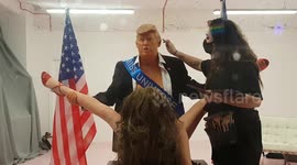 Controversial Donald Trump sculpture draws crowd in London's Soho