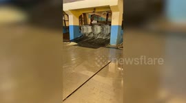 Giant ice cubes slide along factory floor in Thailand