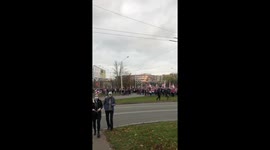 Riot police fired stun grenades at protesters as tens of thousands of people headed toward Independence Palace in Minsk