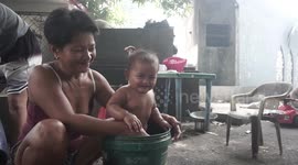 Families made homeless during pandemic are living in cemetery in the Philippines