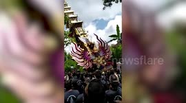 30ft tall coffin tower collapses during funeral procession in Bali, Indonesia