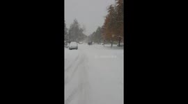 College kids from CU Boulder skiing and snow boarding in the street