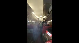 Getting in my seat on the plane full of eariy smoke