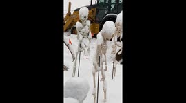 Minnesota household's Halloween decorations covered by early snowfall