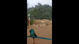 Floodwater races down from mountains into nearby towns as Typhoon Molave hits Vietnam