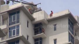 Firefighters rescue troubled man from 39th floor ledge in Jakarta