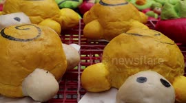 Bakers make colourful loafs of bread for Buddhist Loy Krathong festival