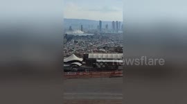 Dust rises from collapsed buildings in Turkish city after powerful earthquake