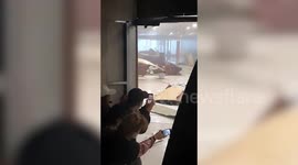 Locals shelter inside shopping centre as Typhoon Goni batters Philippines