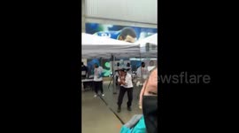 US: Joy To The Polls – Volunteer Performs To Treat Voters On Election Day