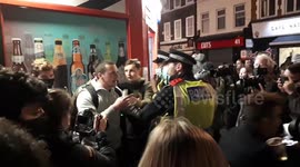 Police detain revellers as crowds dispersed in London's Soho hours before second lockdown