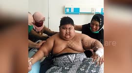 Indonesian boy, 13, taken to hospital after getting so fat he was bed-ridden