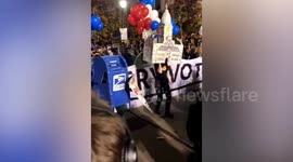'Count every vote': Jubilant Democrat supporters dance outside vote-counting centre in Philadelphia