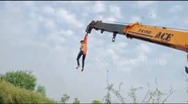 Indian rescuers go 40-feet-high in crane to pull out cow from marshy land