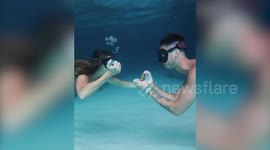 This is the romantic moment a man proposed to his fiancee on the seafloor of a Carribean cave