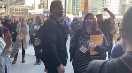 People sing and chant for fair vote counting in Detroit, Michigan