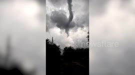 Fifty homes damaged after snake-shaped tornado batters village in Indonesia