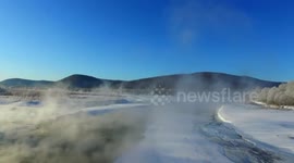 Eerie phenomenon of fog hanging over river that never freezes in China