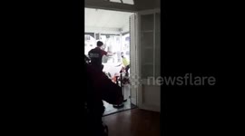 'Shoot him, he's going to kill her!' Police in Argentina save a woman from being attacked with a knife