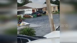 US man rides jet ski through flooded streets in Florida