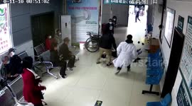 Doctors rush to help patient after she suddenly collapses in Chinese hospital waiting room
