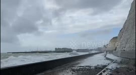 Waves crash over sea wall in Brighton as gales lash UK