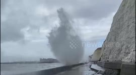 Waves crash over sea wall in Brighton as gales lash UK