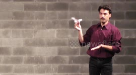 A circus juggler has mastered his chosen art of flying PAPER AIRPLANES