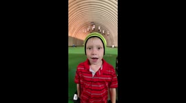 Shane Sky 5 years old hits a golf ball while blind folded and wearing hickey gloves.