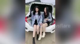 Two girls arrested after filming video in trunk of moving car in China