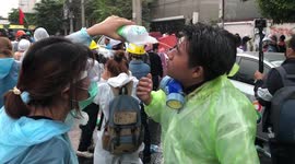 Injured protesters treated by paramedics during violent clashes in Thailand