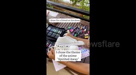 An artist draws on her friend's sneakers in the style of the anime 