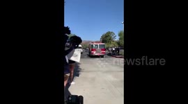 Crowd cheers and give gifts for first responders battling Silverado Fire