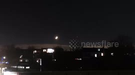 Lunar triangle spotted ove London skyline