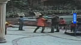 Mother beats man attacking her son